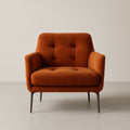 Fauteuil en velours orange avec pieds en métal